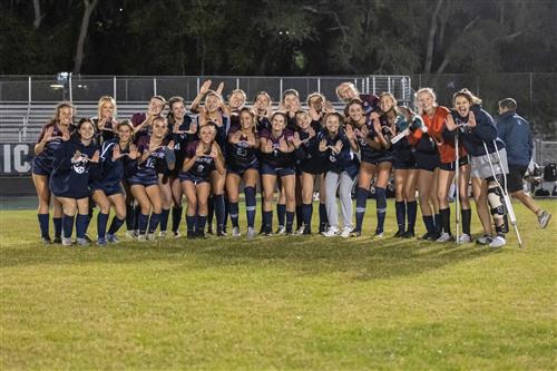 Soccer players on the field after win